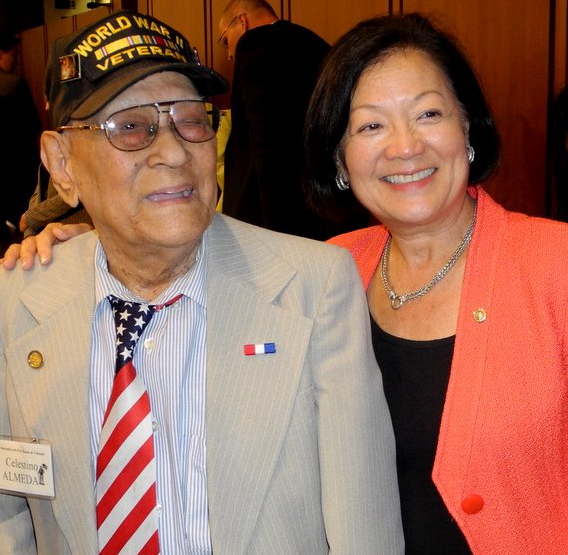 Celestino Almeda, 96, is congratulated by Hawaii Senator Mazie Hirono, principal author of the provision. ACFV photo