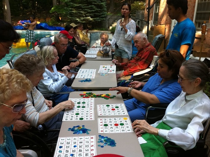 Necitas residents enjoy a game of Bingo (top) and a trip by the lake.