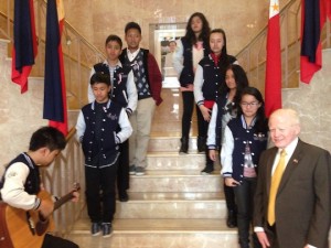 Students serenading Ambassador Jose Cuisia at the Philippine Embassy 