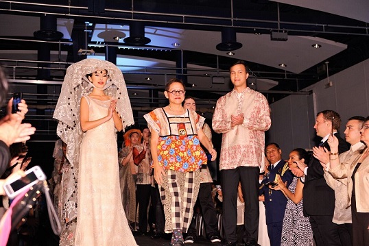Patis Tesoro (center) with her  creations worn by volunteer models