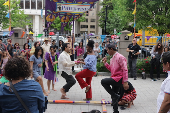 dancing of Tinikling, a traditional Philippine folk dance. 
