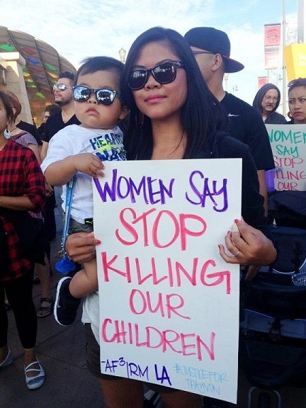 Primrose Villena of AF3IRM Los Angeles with her son Niko who spent his first birthday rallying for Trayvon Martin. Photo:  AF3IRM Los Angeles