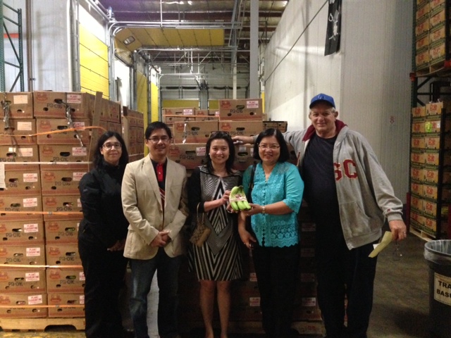 Consul General Hellen Barber Dela Vega (in blue blouse), Agriculture Attache Josyline Javelosa and Trade Representative Jose Dinsay join Yvonne Rentmeester, Dole Manager for Merchandising and Technical Services, and Kerry Genglen of Umina Bros. Inc., in welcoming the first banana shipment at the ripening warehouse in Los Angeles. Philippine Consulate photo
