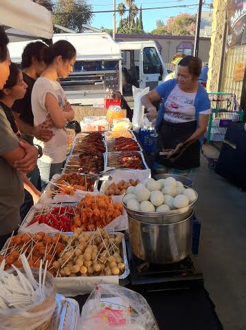 Owner Josephine Chan serves up street food to a line of mostly  homesick Pinoys. Photos by Dante Ochoa