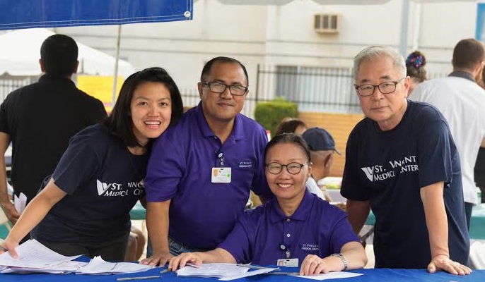 St. Vincent’s Medical Center MHAP Director Pedro Ramirez (center)  coordinates the day's multi- health services for L.A.’s immigrant communities. Volunteers from more than 25 health providers provided assistance. 