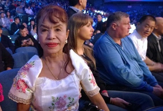 Mother Dionesia Pacquiao sits regally while watching her son fight in a Las Vegas ring