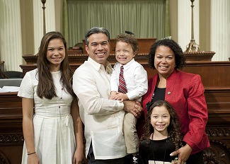 Assemblyman Bonta with wife and children during his swearing-in in Sacramento.  