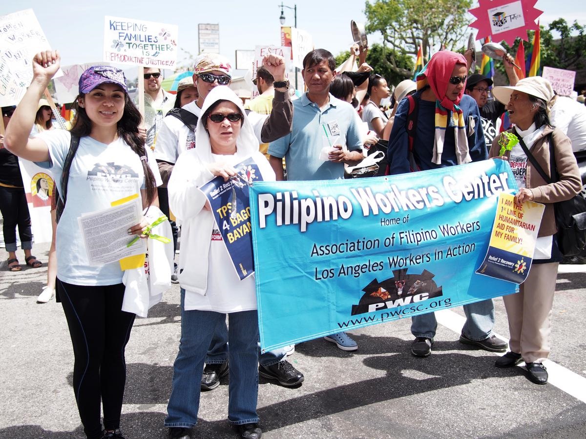 Advocates from Pilipino Workers' Center rally for more governmental support for community programs.