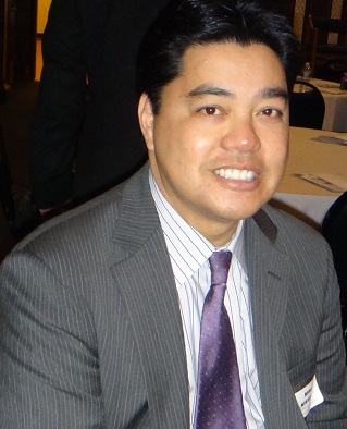 He is one of many Filipinos in financial services. The FilAm photo