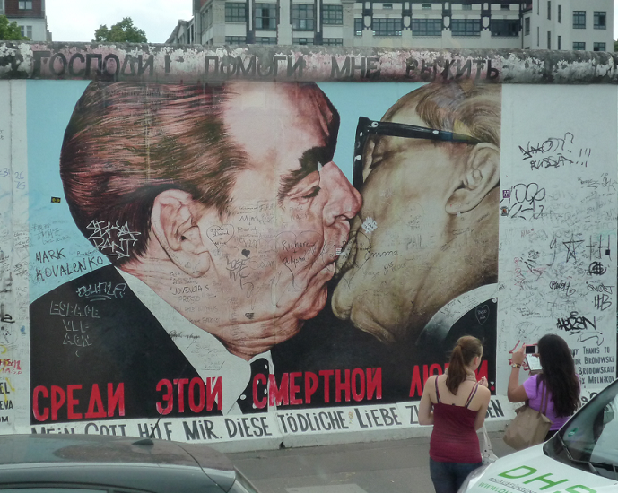 Famous art portrait along the East Side Gallery of the Berlin Wall, depicting the kissing communist leaders Leonid Brezhnev of the Soviet Union and Erich Honecker of East Germany. The painting was inspired by the kiss they had in 1979 during the celebration of the 30 years of the German Democratic Republic (East Germany). Photos courtesy of Wendell Gaa
