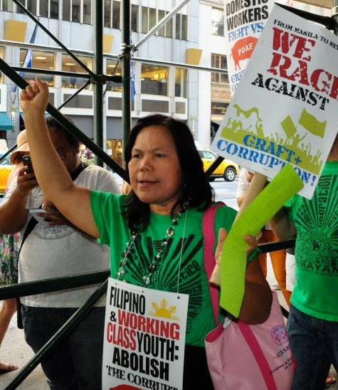 A rallyist from Damayan grassroots organization. Photos by Elton Lugay
