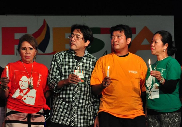 A moment of remembrance led by Nanding Mendez (second from left), with Rose Javier,  Nathan Mendez and Ludi Hughes 