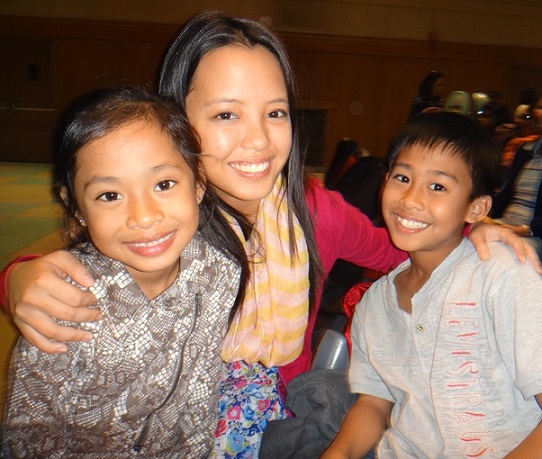 Kirby Asunto (center) with real-life siblings Elijah and Zion Sirilan. The FilAm Photos
