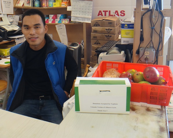 Alfonso Alao and his donation show box. The FilAm photo 
