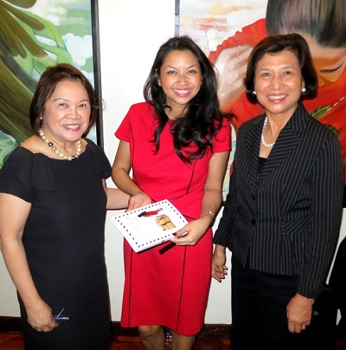 Author Marie Claire Lim Moore at her book launch, with mother Lenore Lim (left) and family friend businesswoman Loida Nicolas Lewis