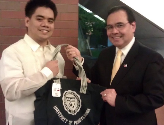 Consul General Mario de Leon Jr. receives a UPenn tote bag from the students. Photo by Joan May Cordova