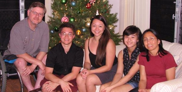 A holiday photo of Daniel with his parents and sisters. 