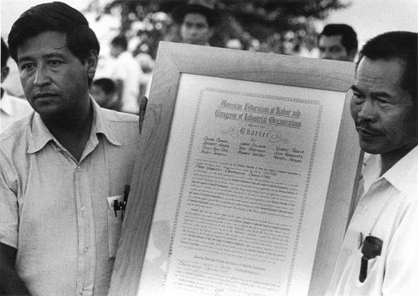 Larry Itliong and Cesar Chavez hold up agreement upholding the merger of their unions: Historic ‘camaraderie’ between Filipino and Mexican workers left out. Photos: FANHS