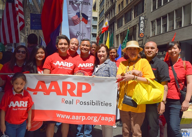 Taguba and AARP New York State Director Beth Finkel (center) with volunteers and community members at the June 1 Philippine Independence Day celebration in New York. Photo by Eric Lachica