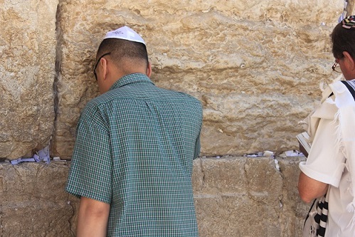 The author touches the Wall in silent meditation.
