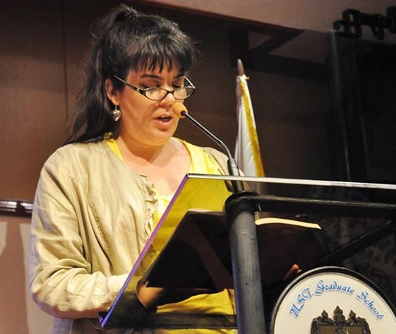 The author reading fiction at a writers summit held at the UST Center for Creative Writing and Literary Studies