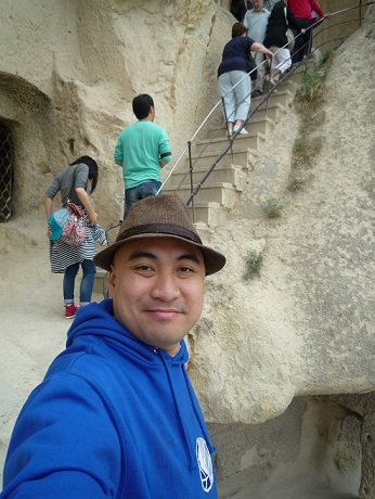 Author takes a selfie before climbing a steep staircase inside one of Cappadocia’s  cave monasteries.