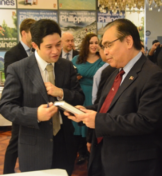 FilAm author David Lat signs a copy of ‘Supreme Ambitions’ for Consul General Mario de Leon, Jr.