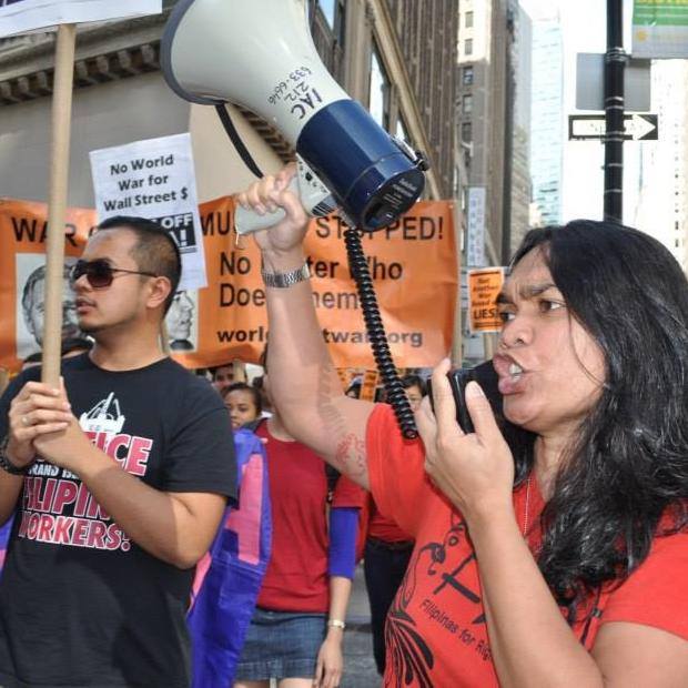 Candice Sering leads fellow FilAm activists at an anti-war rally protesting U.S. military intervention in Syria.
