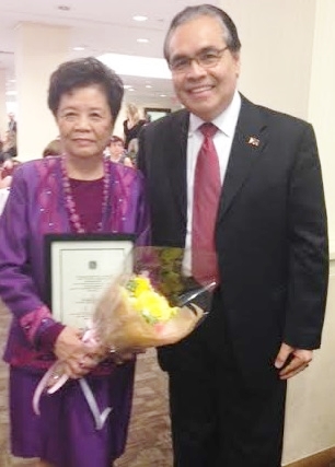 She received her award accompanied by  Consul General Mario de Leon Jr. on stage