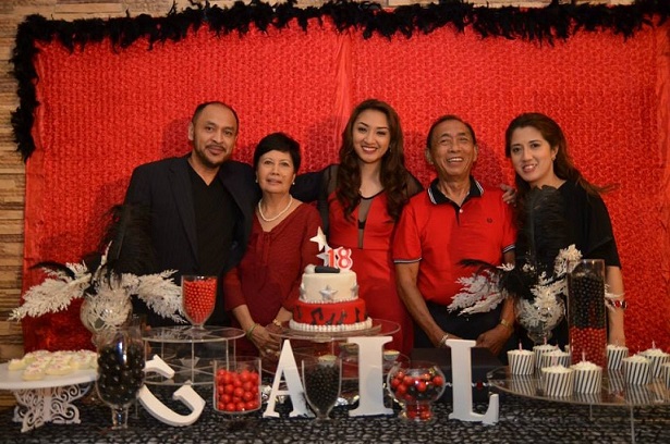 Celebrating her 18th birthday with family.  Also in photo are her parents Gilray (far left) and Janette (far right). Photo by Amie Dizon Banawis
