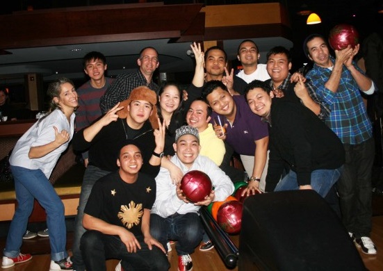Pommes Frites owners and their Filipino managers and staff bond over a game of bowling 