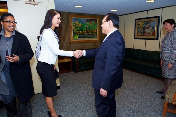 Consul General Mario de Leon and wife Eleanor de Leon welcome Pia Wurtzbach to the Philippine Center. Miss Universe Director of Talent Esther Swan is at left.