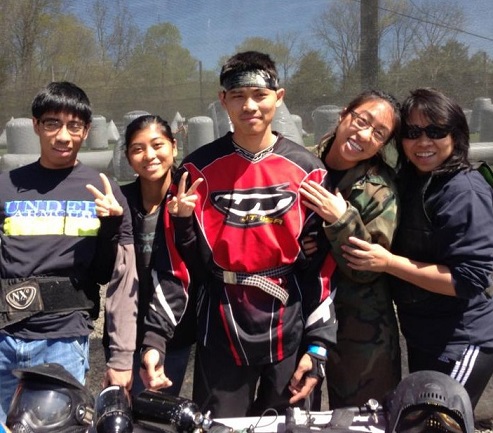 Ninia (far right) with children, from left: John, Cindy, Jonah and Kelly after a game of paintball. 