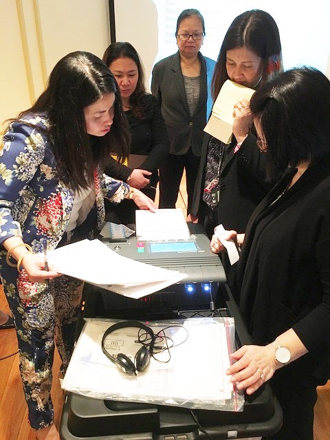Elections and consular officials test a Vote Counting Machine at the Philippine Embassy in Washington D.C. 