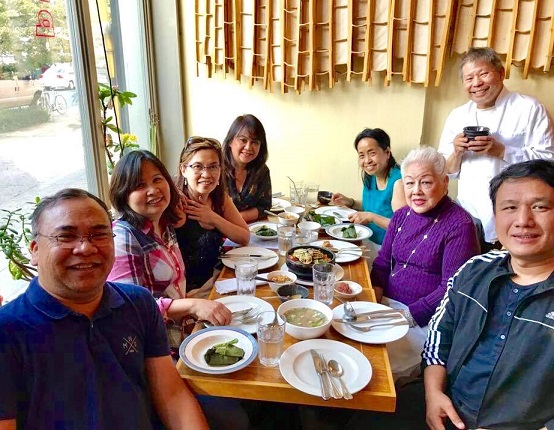 Purple Yam chef Romy Dorotan whips up a Filipino Restaurant Week feast for this table of FilAm customers. Photo by Grace Labaguis