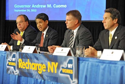 With Gov. Andrew Cuomo at the 2012 launch of 'Recharge New York,' a program that offers low-cost power to local businesses as incentive for keeping their companies and jobs in the state. 