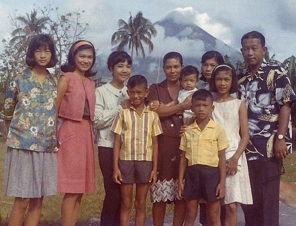 The Vargas family at the famous Mayon Volcano, just before Metty (wearing red headband) came to the U.S. in the 1960s. She was followed by sister Nancy (to her left), a nurse, two months later. The Bicol-born Metty is the eldest of eight siblings.   