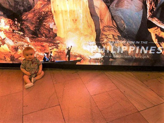 A Filipina nanny brings a baby in her care to Grand Central.