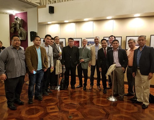 Carlos’ most recent show on May 14 was a joint exhibit with fraternity brother Dr. Thor Lidasan. ‘Photography of Visible and Invisible Light’ was organized by Alpha Phi Beta’s East Coast Chapter, and held at the Philippine Center. In photo are Deputy Consul General Kerwin Tate (far left) and Consul Arman Talbo (4th from right). Photo courtesy of Arman Talbo