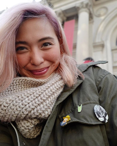 In Manhattan, wearing her collection of enamel pins: Beatles, Van Gogh, and rock & roll. Instagram photo.