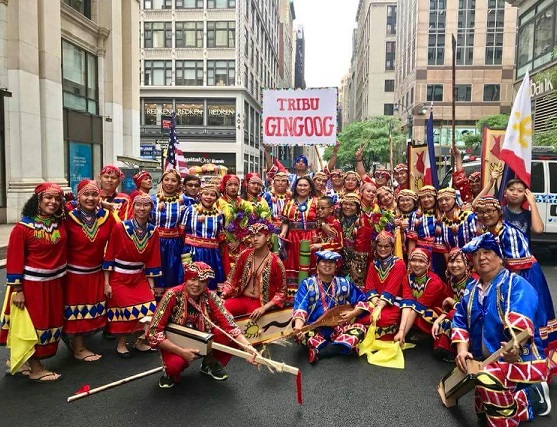 Members of GIUSA (Gingoognons in the United States of America) celebrate their participation in the 2018 Independence Day Parade. Nora (center) came to know PIDCI through the parade. Today, she is a member of the board.